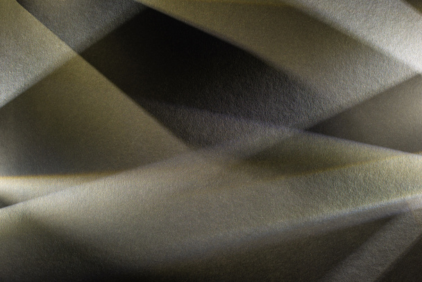 light prism with beams on dark textured background - Фото, изображение