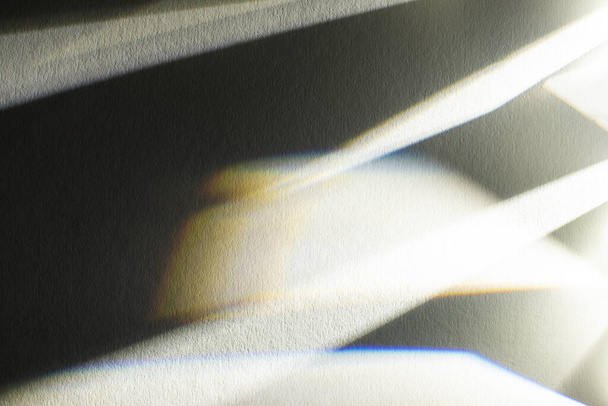 light prism with beams on dark textured background - Фото, зображення
