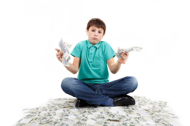 boy sitting on money - Photo, Image