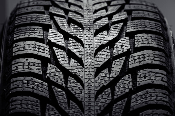Stack of brand new high performance car tires on clean high-key white studio background. new car tire background. close up of texture - Photo, Image