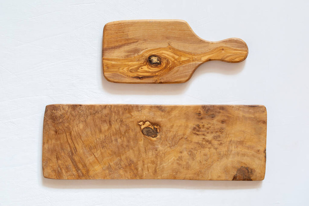 Kitchen boards made of natural olive wood on a white background. Eco-friendly dishes.  - Photo, Image