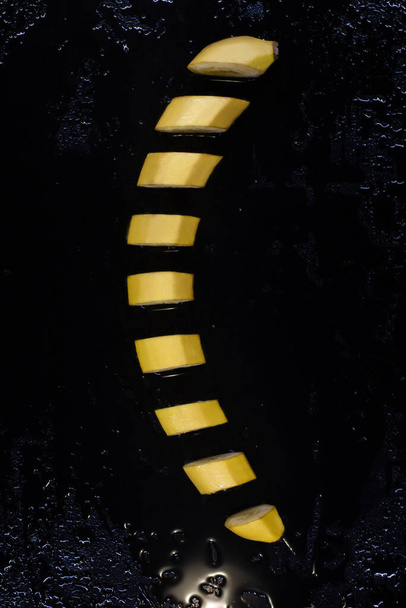 banana sliced on a black tray - Photo, Image