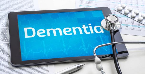 The word Dementia on the display of a tablet - Photo, Image