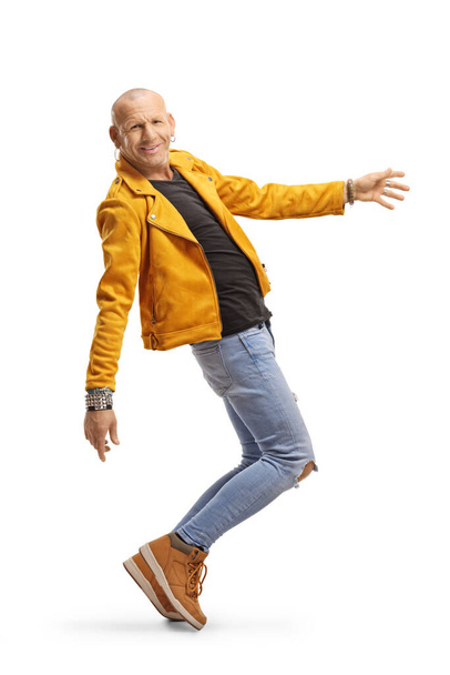 Full length shot of a smiling man dancing isolated on white background - 写真・画像
