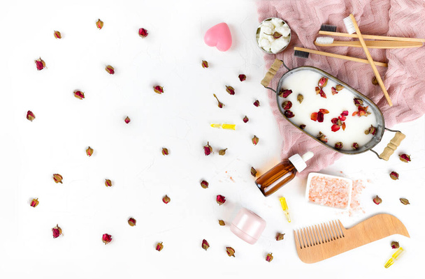self-care kit for hair, body, face. soap nuts, rose petals, coconut oil, soap bath. concept DIY natural eco cosmetics, masks, scrubs, home spa. zero waste, no plastic, conscious. copy space. flat lay - Photo, Image