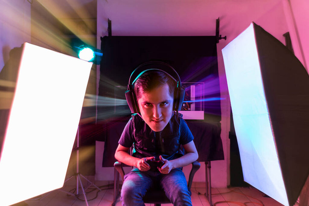 Expression session. Young man playing videogames with different facial expressions - Foto, Imagen