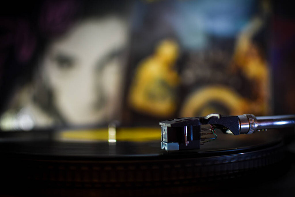 Listening to music on a vinyl player. - Photo, Image