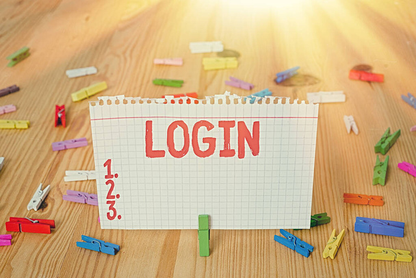Conceptual hand writing showing Login. Business photo showcasing Entering website Blog using username and password Registration Colored crumpled papers wooden floor background clothespin. - Photo, Image