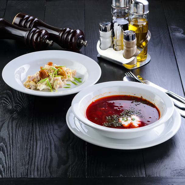 two dishes on the table - lunch with Traditional russian borsch on wooden table backgroundBeetroot soup borscht. - Zdjęcie, obraz