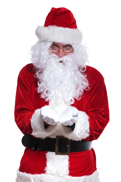 santa claus is holding something on his hands - Foto, afbeelding