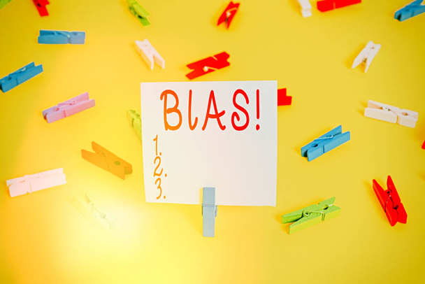 Word writing text Bias. Business concept for inclination or prejudice for or against one demonstrating group Colored clothespin papers empty reminder yellow floor background office. - Photo, Image