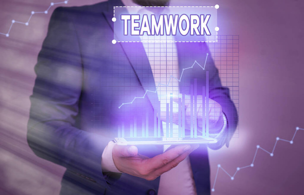 Conceptual hand writing showing Teamwork. Business photo text combined action of group especially when effective and efficient. - Photo, Image