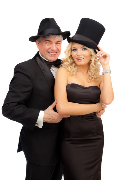 Man and woman in elegant suits and hats - Fotó, kép