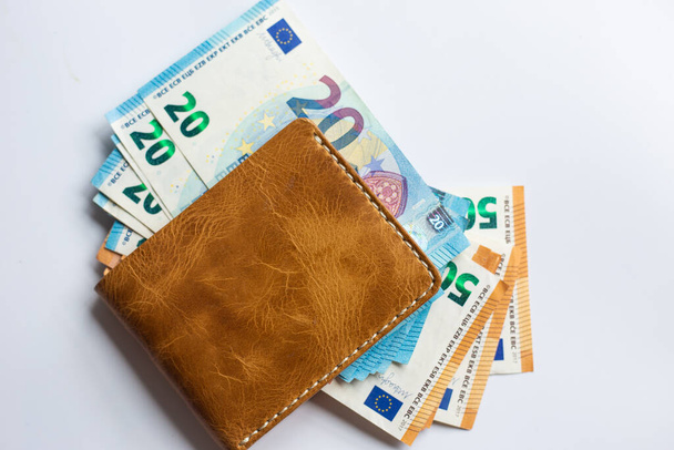 Euro money in leather wallet business finance on white background - Фото, изображение