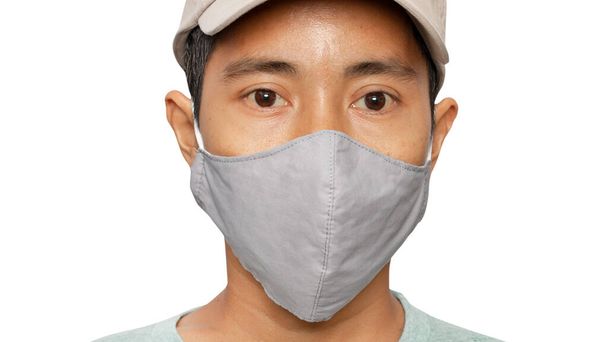 Close up of young male wearing protective face mask on white background. - caminhos de recorte. - Foto, Imagem