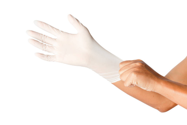 La mano humana lleva un guante médico aislado sobre fondo blanco. caminos de recorte
. - Foto, Imagen