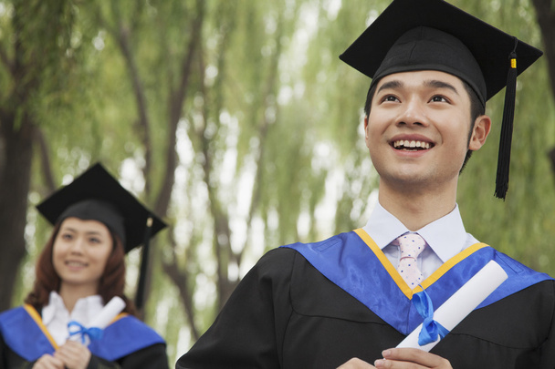 University Graduates Holding Diplomas - Foto, Bild