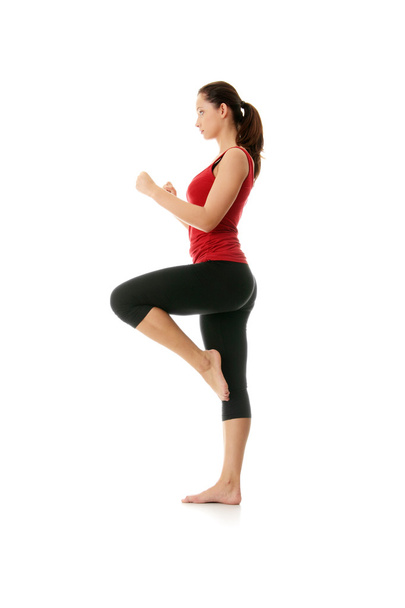 Young woman doing yoga exercise - Фото, изображение