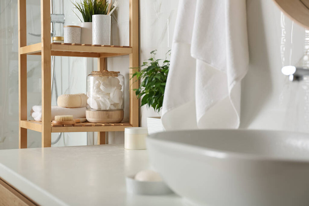 Shelving unit with toiletries in bathroom interior - Foto, afbeelding