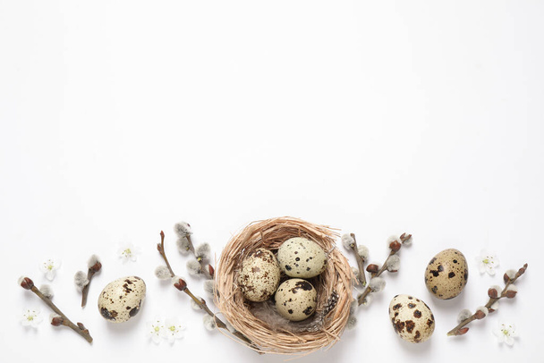 Flat lay composition with quail eggs on white background, space for text. Easter celebration - Foto, Imagen
