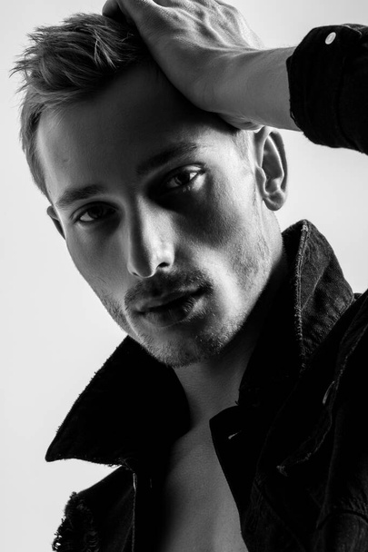 Portrait Of A Handsome Fashion Man In Black Jean Jacket On White Background - Fotoğraf, Görsel
