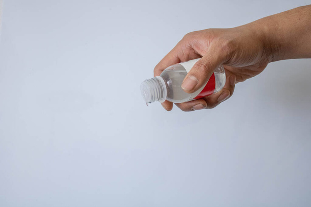 man pouring sanitizer , on focus hand with gel - Photo, Image