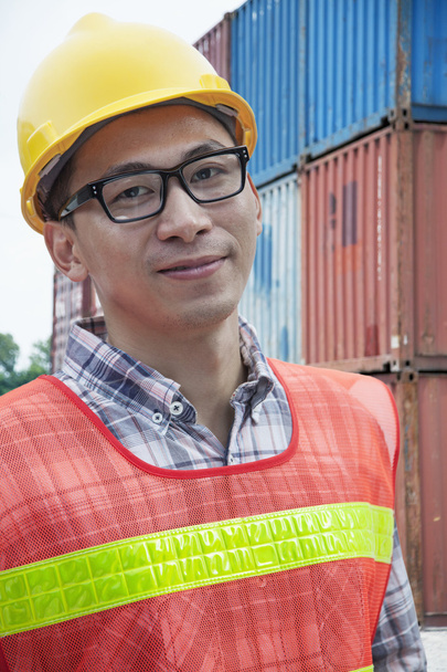 Engineer outdoors in a shipping yard - 写真・画像