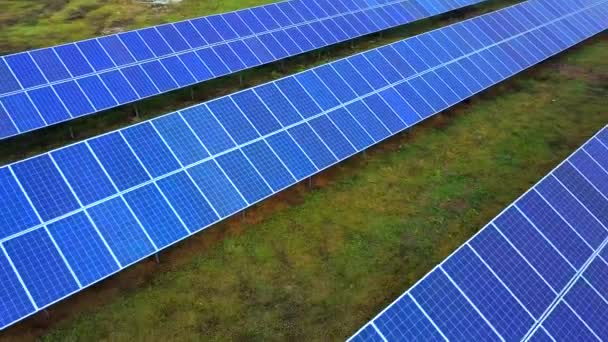 Solar power plant in summer. Innovative solar batteries on the field. Production of clean energy. Aerial view. - Footage, Video