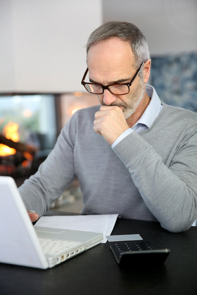 Mature man working with laptop - Photo, image