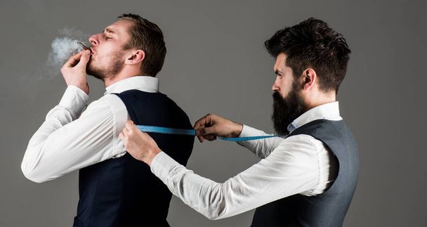 Tailor measure back for sewing suit, grey background. - Foto, Imagem