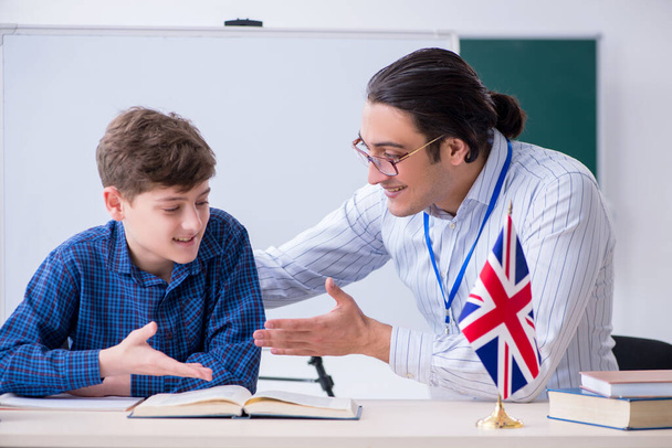 Male english teacher and boy in the classroom - Photo, Image