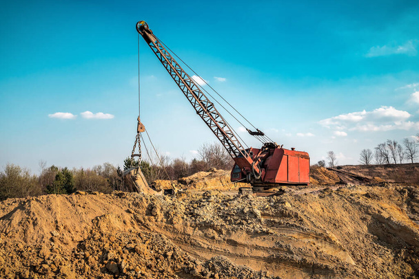 old dragline excavator in yellow clay quarry - Photo, Image