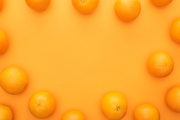 top view of ripe juicy whole oranges on colorful background - Photo, image