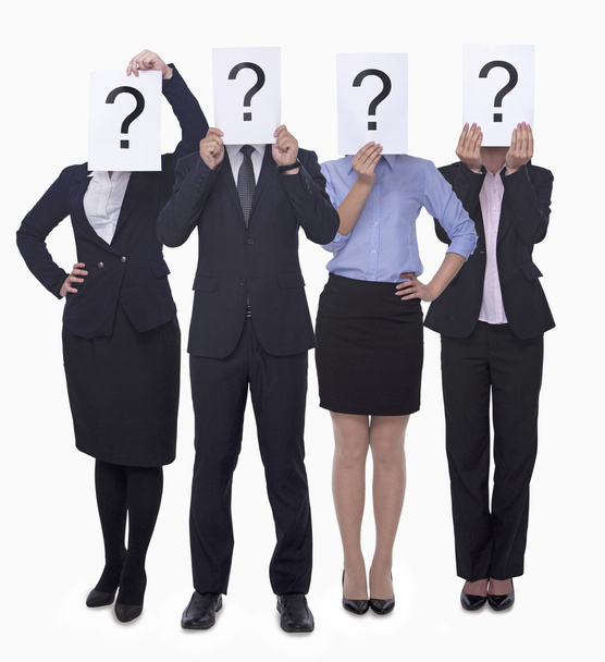 Business people holding up paper with question mark - Photo, Image
