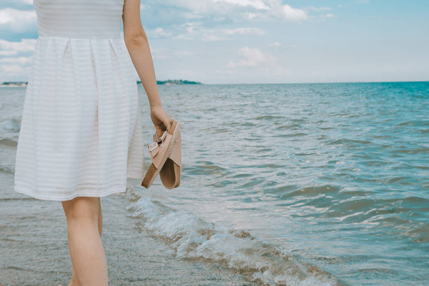 girl with beach slippers  - Фото, зображення