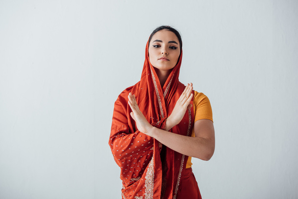 Young indian woman in sari showing no gesture isolated on grey - Фото, изображение