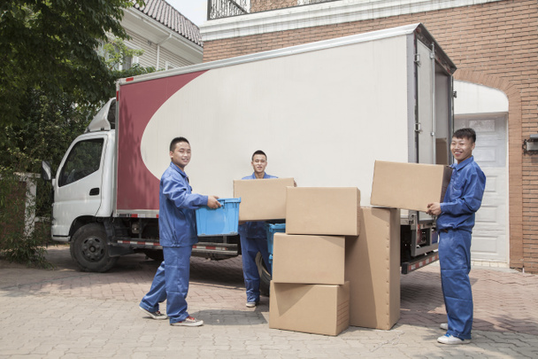 Movers unloading a moving van - Photo, Image