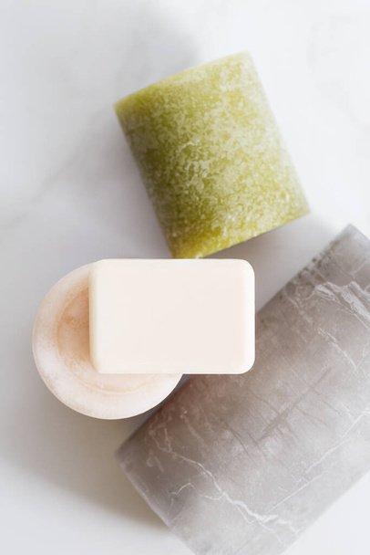 Soap for hands with mock up space at light background with candles. Top view, free space for text, template, frame, Concept of sanitize picture - Fotó, kép