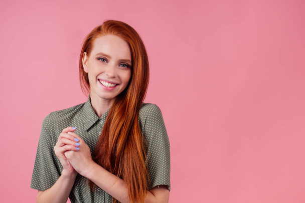 happy redhair ginger woman in studio background feeling heart thanks - Foto, immagini