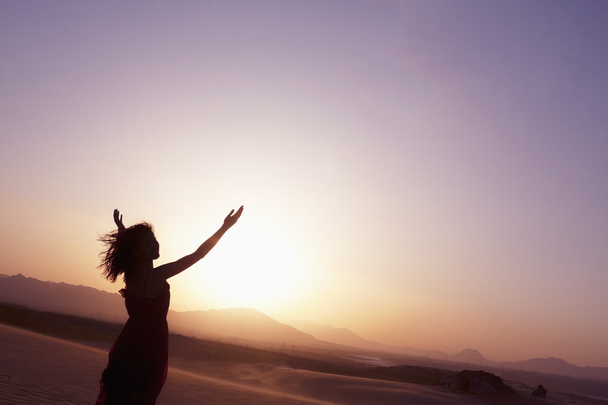 Woman doing yoga in the desert - Photo, Image