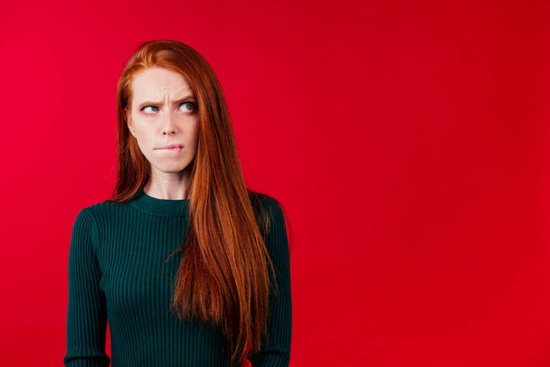attractive redhair ginger woman cant keep secrets studio background - Fotoğraf, Görsel