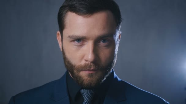 Portrait of handsome young bearded businessman in classic suit - Footage, Video