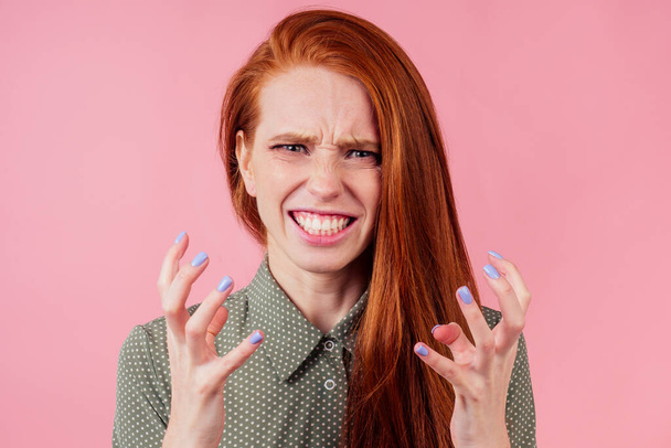 redhair ginger woman disappointed looking studio background - Foto, immagini