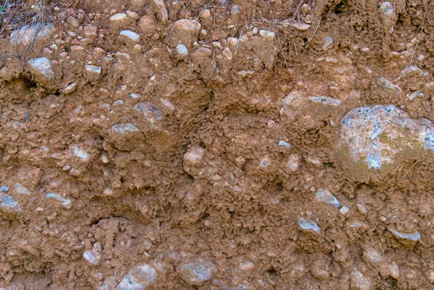 Detail van oppervlaktestructuur met kleine kiezelsteen. Oppervlakte van zand en rotsen - Foto, afbeelding