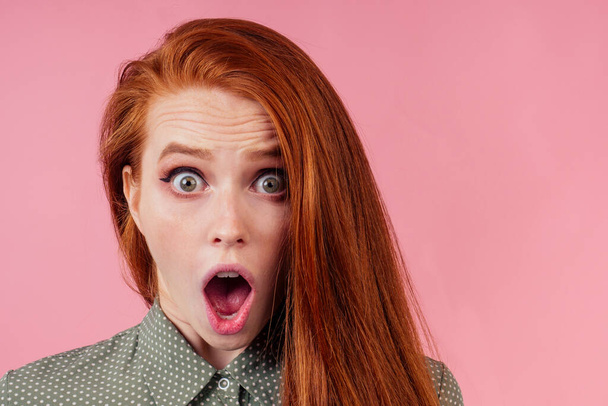 attractive redhair ginger woman cant keep secrets studio background - Φωτογραφία, εικόνα