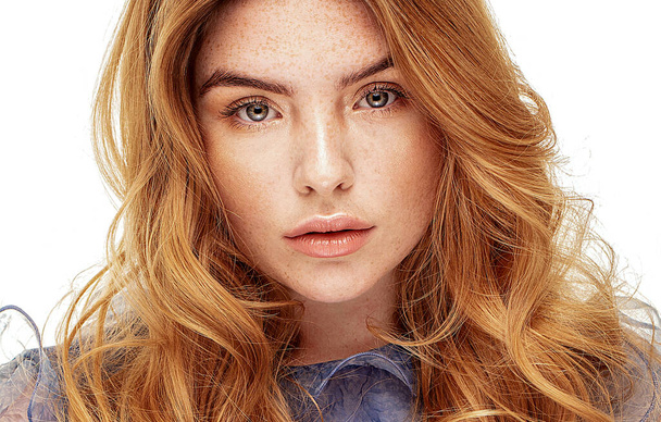 Beauty portrait of charming caucasian ginger young woman with natural freckles. Girl looking at camera. A lot of copy space. - Foto, afbeelding