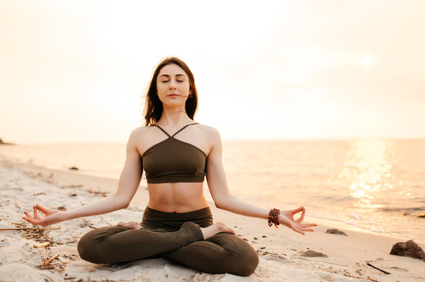 yoga meditation sunset nature girl woman calm asana sea fitness sport - Valokuva, kuva