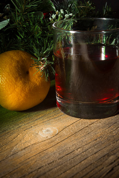 Wine and tangerines on a New Year's table - Φωτογραφία, εικόνα