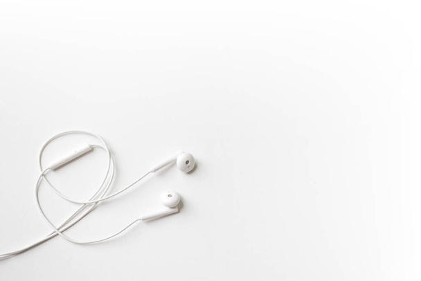 white earphone on white background. flat lay. - Photo, Image