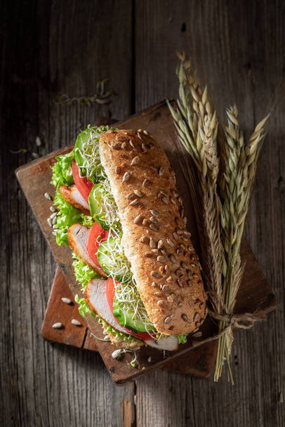 Top view of sandwich with lettuce, tomato and roasted chicken - Fotoğraf, Görsel